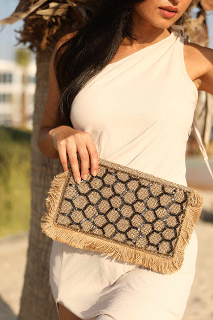 Honeycomb design clutch with a sling
